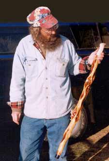 Photo of EJFoot Holding Diamond Willow handcrafted walking stick